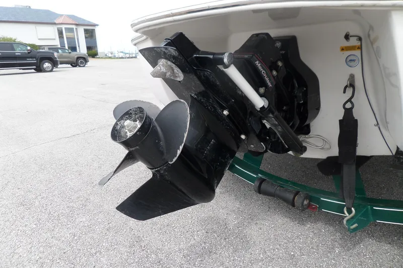 Slide: The Image of 2005 Tahoe Q4 Sport boat with MerCruiser outboard motor and propeller detail. - 8