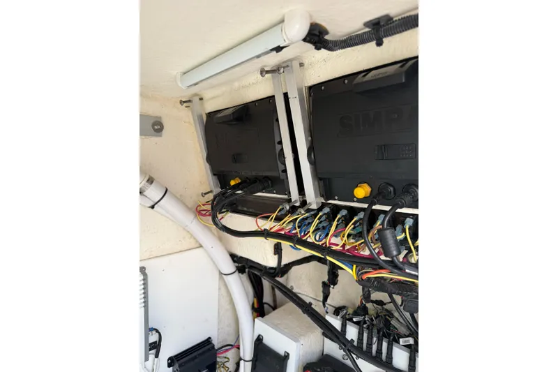 Slide: The Image of Electrical wiring and components inside a 2021 Sea Born LX24 Center Console boat. - 15