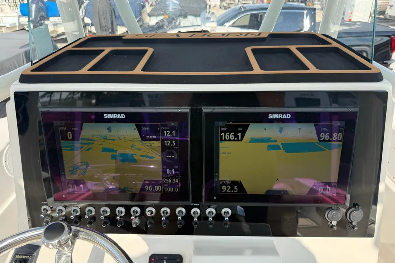 Slide: The Image of 2021 Sea Born LX24 Center Console dashboard with dual Simrad displays. - 18