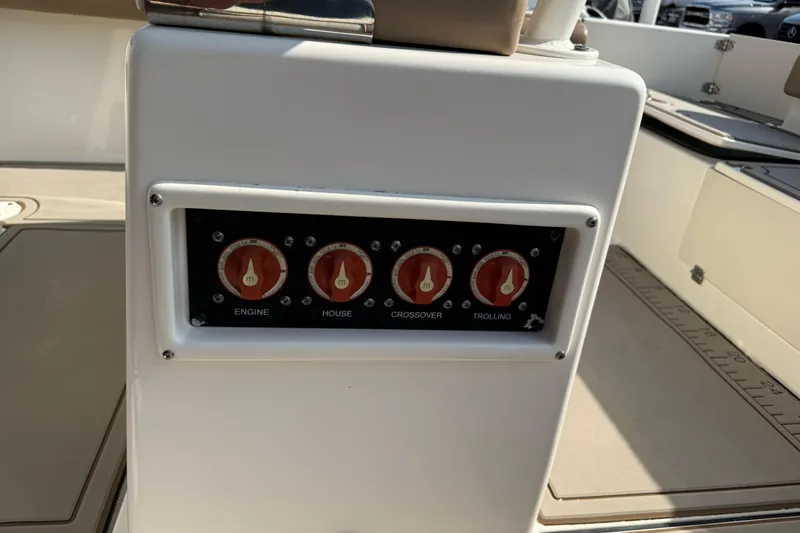 Slide: The Image of Control panel on 2021 Sea Born LX24 Center Console boat with labeled switches. - 19