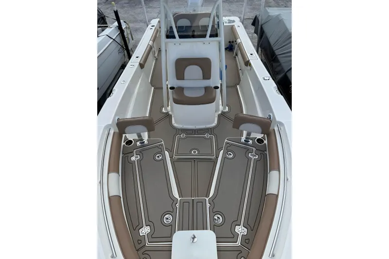 Slide: The Image of 2021 Sea Born LX24 Center Console boat interior with cushioned seating and modern design. - 6