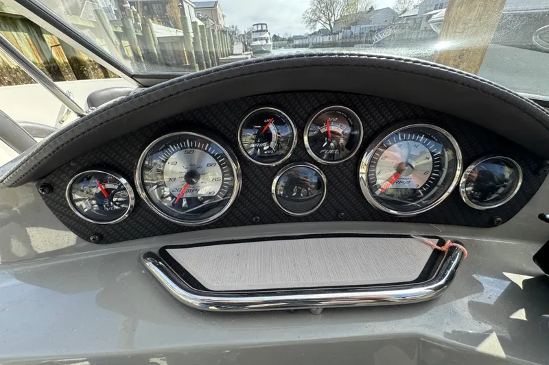 Slide: The Image of Dashboard of a 2019 Stingray 204 LR boat with gauges and controls. - 21