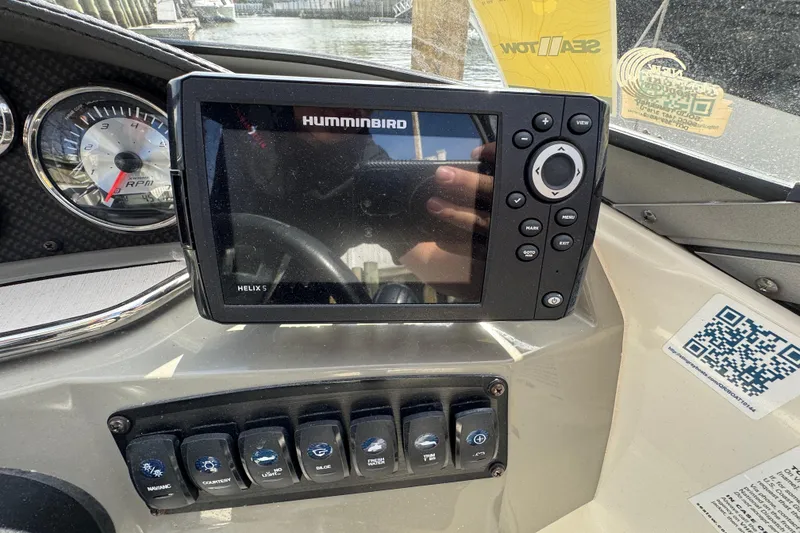 Slide: The Image of Dashboard of a 2019 Stingray 204 LR boat with Humminbird Helix 5 GPS. - 22