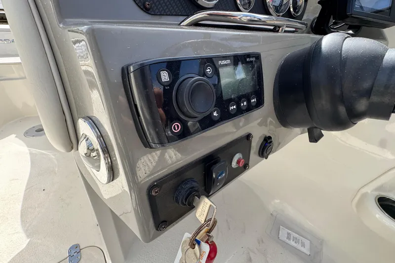 Slide: The Image of Control panel of a 2019 Stingray 204 LR boat with Fusion audio system. - 23