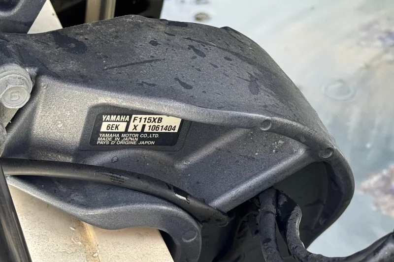 Slide: The Image of Close-up of Yamaha F115XB motor part on 2019 Stingray 204 LR boat. - 8