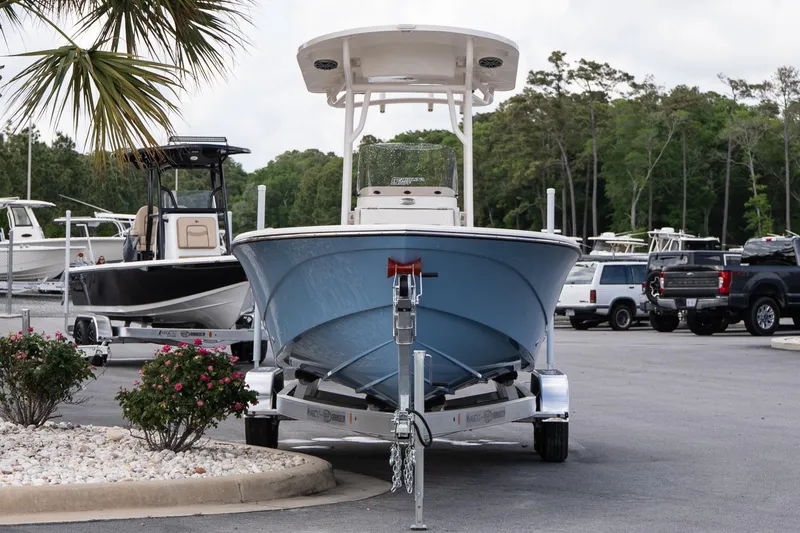 Slide: The Image of 2026 Carolina Skiff 24 Ultra Elite boat on trailer in parking lot. - 2