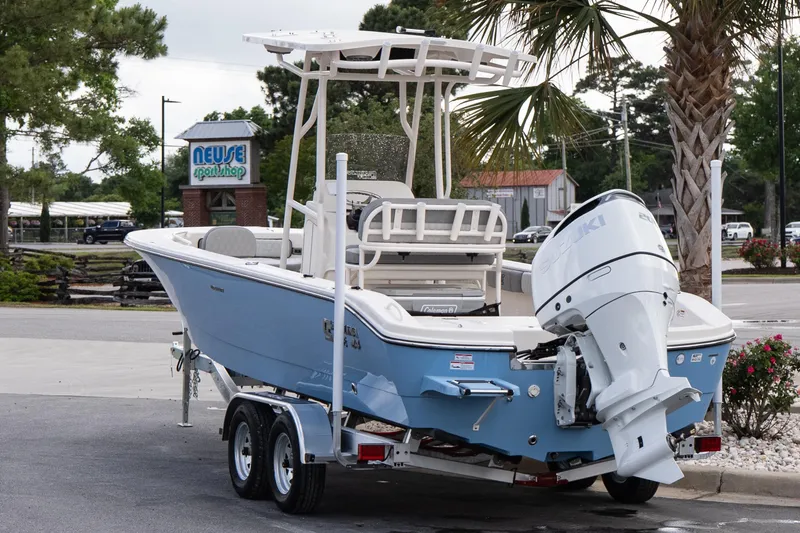 Slide: The Image of 2026 Carolina Skiff 24 Ultra Elite boat on trailer, parked near Neuse Sport Shop. - 3