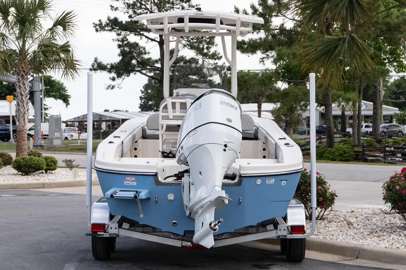 Slide: The Image of 2026 Carolina Skiff 24 Ultra Elite boat on trailer, parked outdoors. - 4