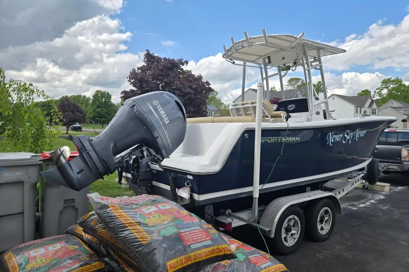 Slide: The Image of 2018 Sportsman Heritage 231 Center Console boat on trailer, featuring Yamaha outboard motor. - 3