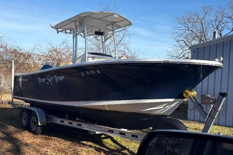 Slide: The Image of 2018 Sportsman Heritage 231 Center Console boat on trailer, parked outdoors. - 6
