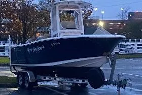 Slide: The Image of 2018 Sportsman Heritage 231 Center Console boat on trailer in parking lot. - 7