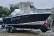 Slide: The Image of 2018 Sportsman Heritage 231 Center Console boat on trailer, outdoors. - 8