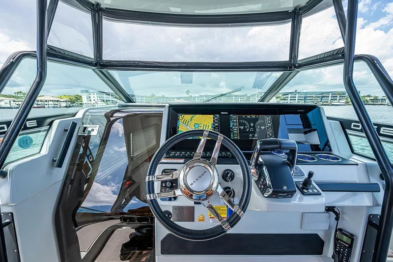 Slide: The Image of Cockpit view of 2023 Saxdor 320 GTO with modern steering and navigation controls. - 17