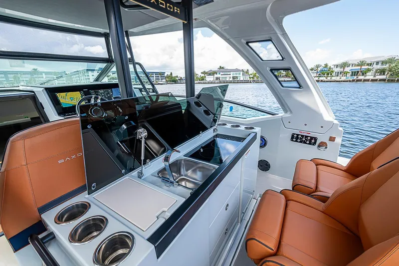 Slide: The Image of Interior of 2023 Saxdor 320 GTO boat with luxurious seating and modern amenities. - 20