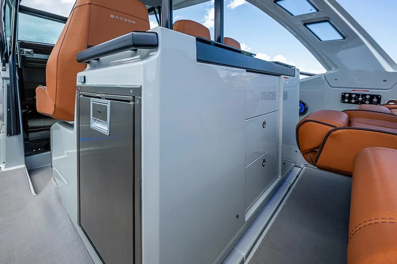 Slide: The Image of Interior of 2023 Saxdor 320 GTO boat with modern seating and storage. - 22