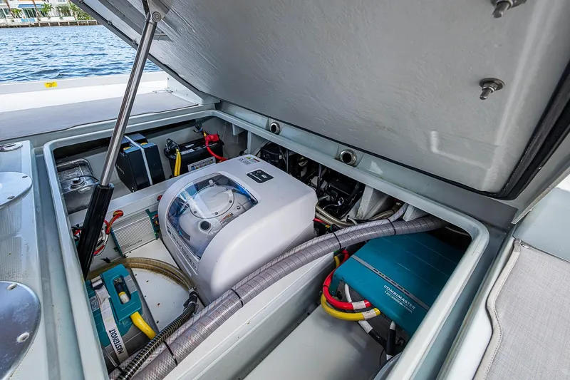 Slide: The Image of Open engine compartment of 2023 Saxdor 320 GTO boat, showcasing internal components and wiring. - 23