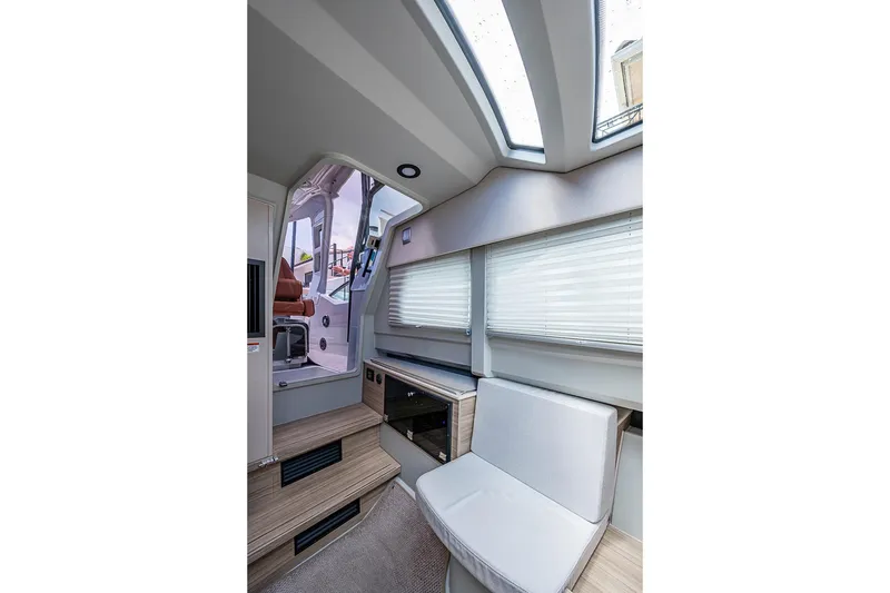 Slide: The Image of Interior of 2023 Saxdor 320 GTO boat, featuring modern seating and skylights. - 30
