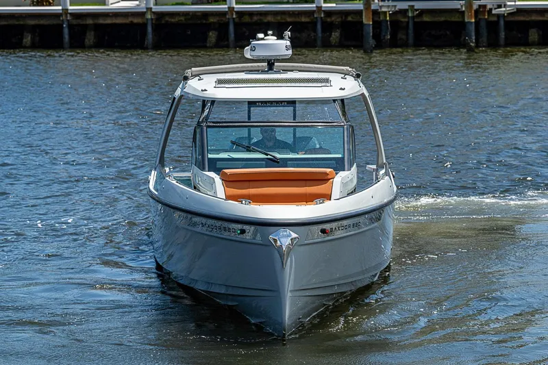 Slide: The Image of 2023 Saxdor 320 GTO boat cruising on water, showcasing sleek design and modern features. - 4
