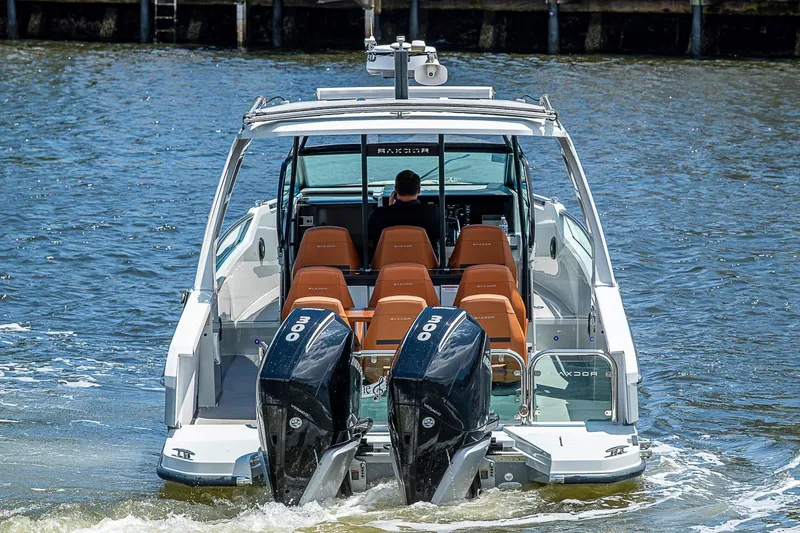 Slide: The Image of 2023 Saxdor 320 GTO boat with dual engines cruising on water. - 6
