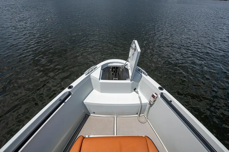 Slide: The Image of 2023 Saxdor 320 GTO boat bow with open hatch on calm water. - 9