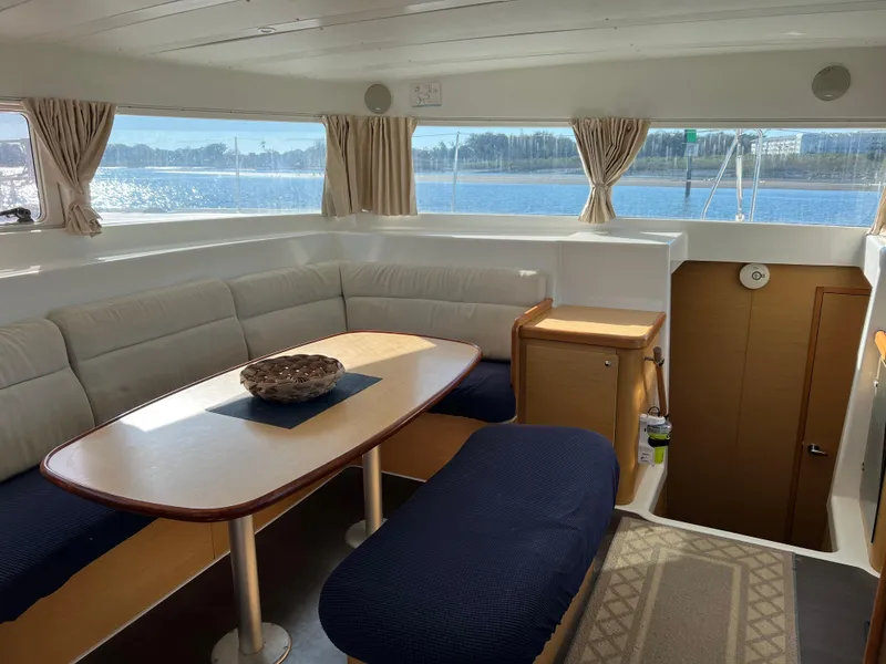Slide: The Image of Interior of a 2008 Lagoon 420 yacht with cozy seating area. - 12