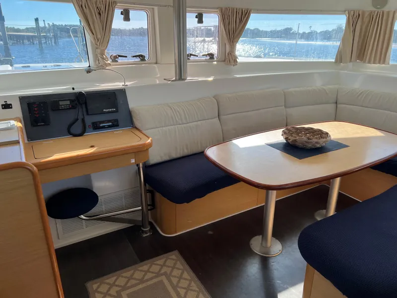 Slide: The Image of Interior of a 2008 Lagoon 420 yacht with cozy seating area. - 13