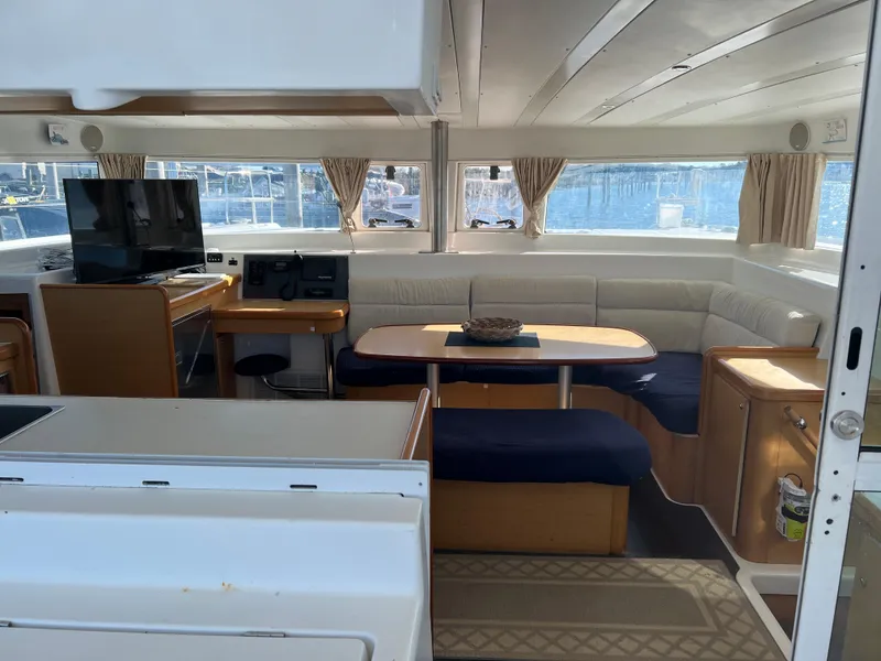 Slide: The Image of Interior of a 2008 Lagoon 420 yacht with cozy seating area. - 14
