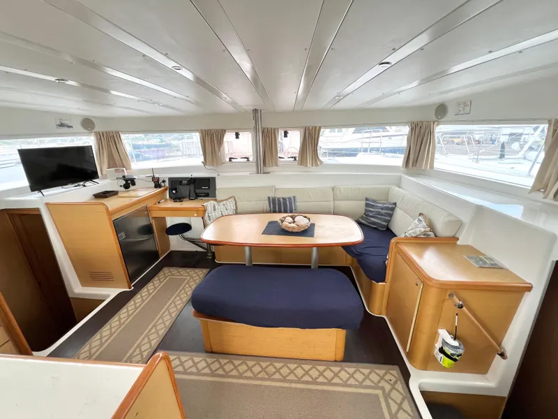 Slide: The Image of Interior of 2008 Lagoon 420 yacht with cozy seating, table, and modern amenities. - 15