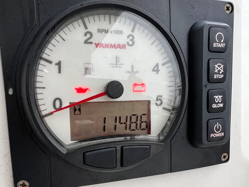 Slide: The Image of Yanmar RPM gauge on 2008 Lagoon 420, displaying 1148.6 hours. - 25