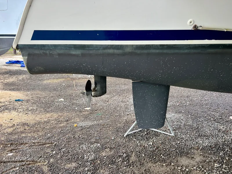 Slide: The Image of 2008 Lagoon 420 catamaran hull and rudder on dry land. - 30