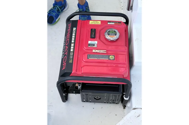 Slide: The Image of Red Predator inverter generator on a 2008 Lagoon 420 boat deck. - 40