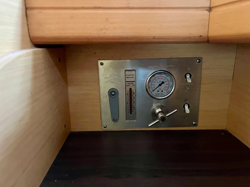 Slide: The Image of Control panel of a 2008 Lagoon 420 yacht, featuring gauges and switches. - 43