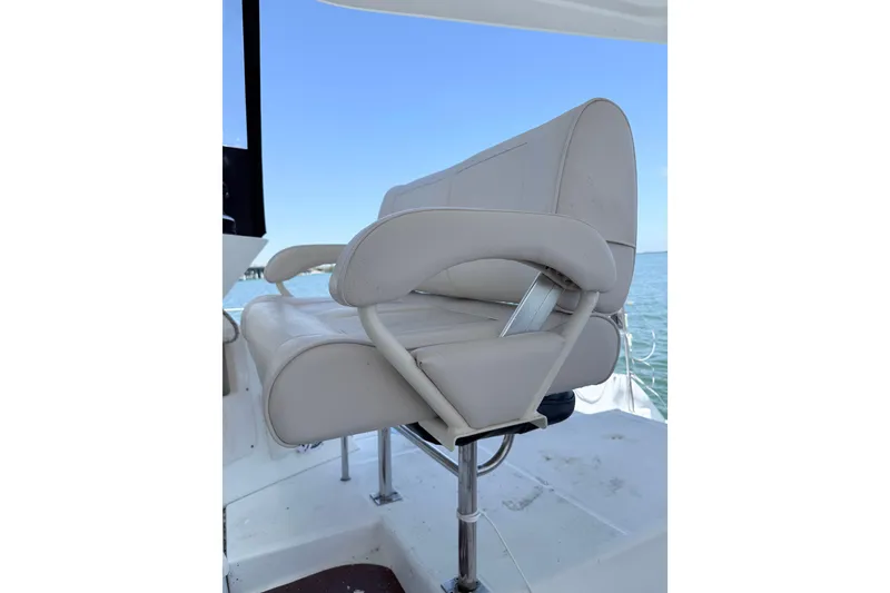 Slide: The Image of Captain's chair on 2008 Lagoon 420 yacht, overlooking the ocean. - 9