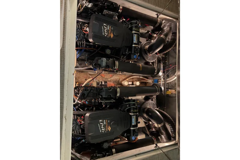 Slide: The Image of Engine compartment of a 2002 Sea Ray 290 Amberjack with dual motors. - 16