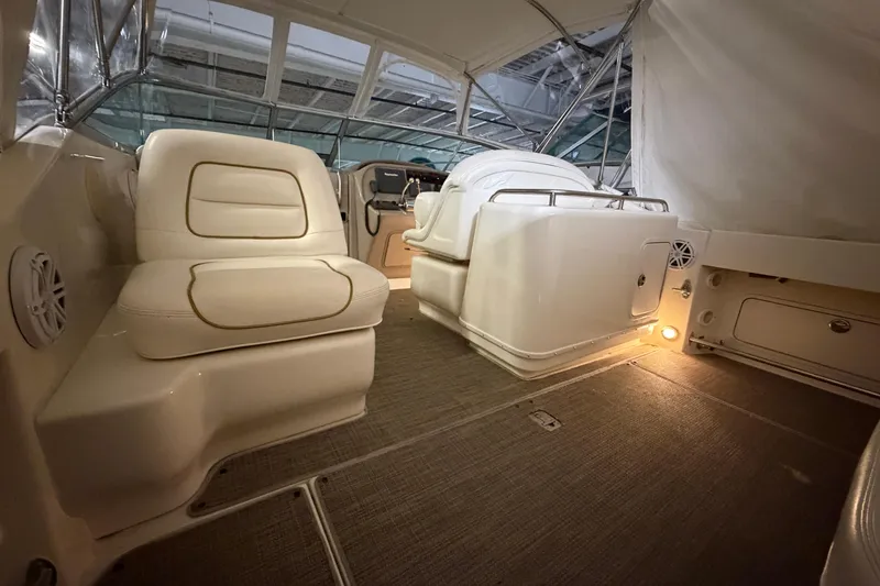 Slide: The Image of Interior of 2002 Sea Ray 290 Amberjack boat with cushioned seating and helm. - 3