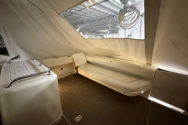 Slide: The Image of Interior of 2002 Sea Ray 290 Amberjack boat with seating and storage. - 4