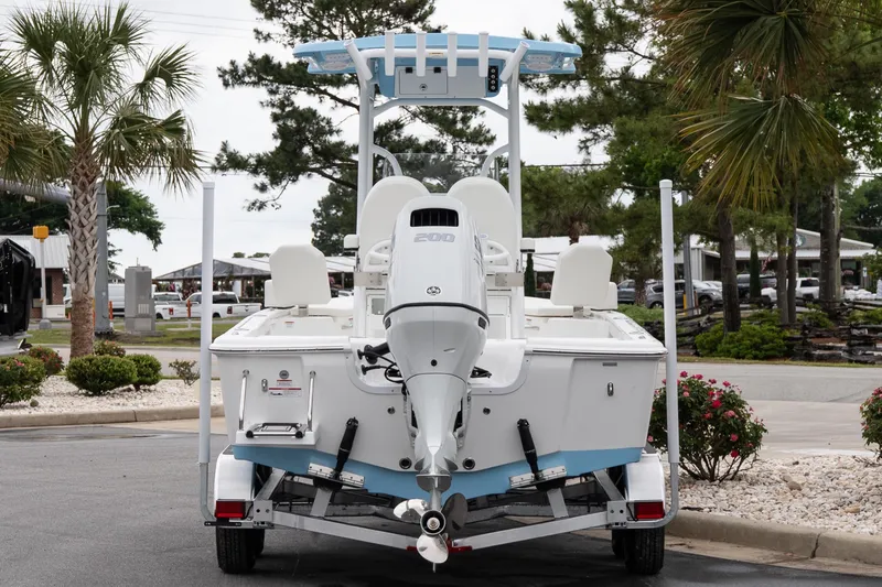 Slide: The Image of 2026 Sea Pro 230 Bay boat on trailer, rear view, parked outdoors. - 5