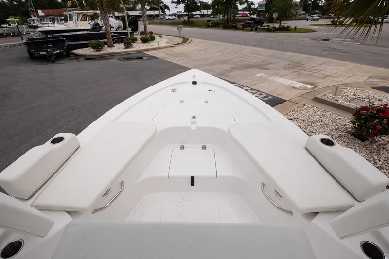 Slide: The Image of 2026 Sea Pro 230 Bay boat deck with seating and storage compartments. - 9