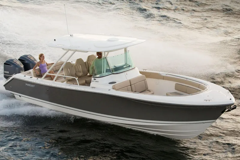 Slide: The Image of Manufacturer Provided Image: 2015 Pursuit ST 310 Sport boat cruising with passengers on a calm waterway. - 19