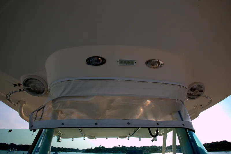 Slide: The Image of 2015 Pursuit ST 310 Sport boat interior with speakers and lighting fixtures. - 21