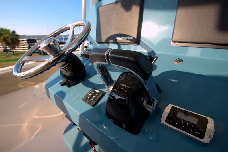 Slide: The Image of Control panel of 2015 Pursuit ST 310 Sport boat with steering wheel and throttle. - 17