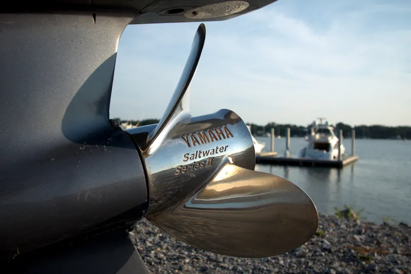 Slide: The Image of Close-up of Yamaha Saltwater Series propeller on 2015 Pursuit ST 310 Sport boat. - 26