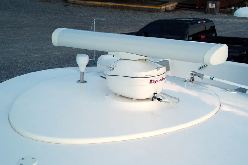Slide: The Image of Radar equipment on a 2015 Pursuit ST 310 Sport boat, featuring Raymarine technology. - 32