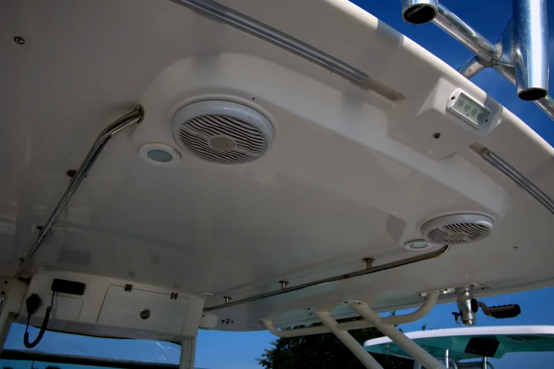 Slide: The Image of 2015 Pursuit ST 310 Sport boat interior with speakers and lighting fixtures. - 44