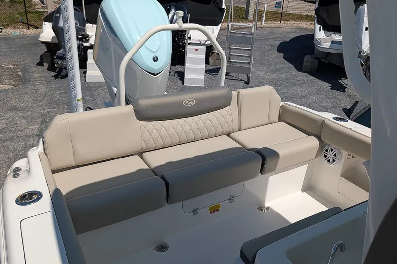 Slide: The Image of 2026 Key West 249 FS boat interior with beige seating and modern design. - 10