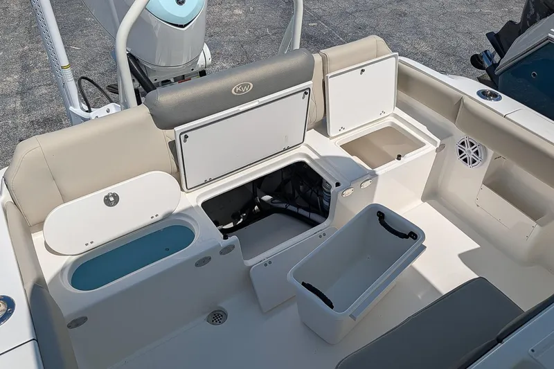 Slide: The Image of 2026 Key West 249 FS boat interior with storage compartments and seating. - 11