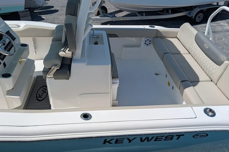 Slide: The Image of 2026 Key West 249 FS boat interior with seating and steering console. - 12