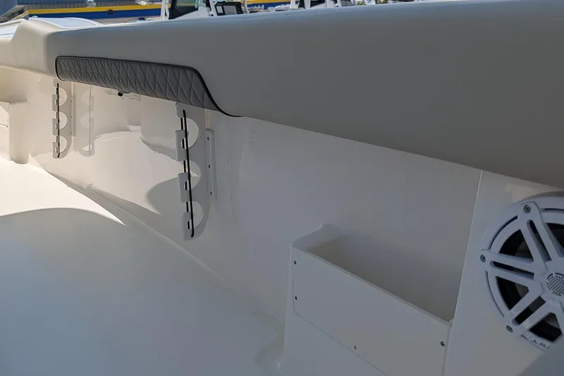 Slide: The Image of Interior view of 2026 Key West 249 FS boat, featuring rod holders and speaker. - 15