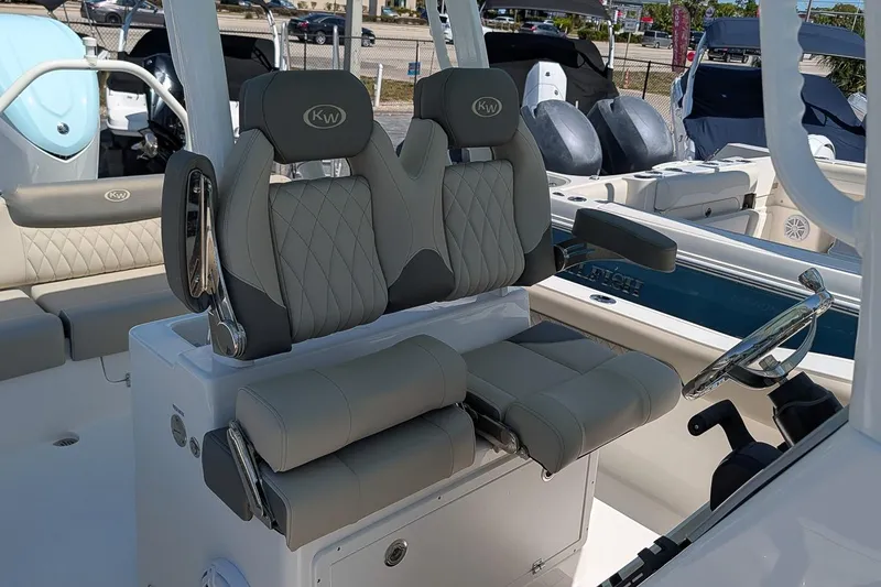 Slide: The Image of 2026 Key West 249 FS boat interior with luxurious seating and modern steering console. - 16