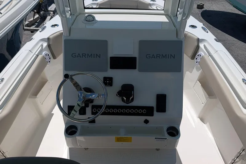 Slide: The Image of 2026 Key West 249 FS boat console with Garmin navigation system and steering wheel. - 18
